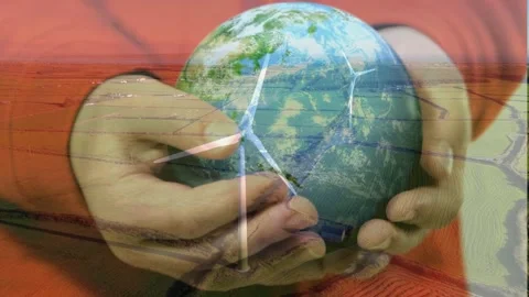 Hands Holding Globe with Wind Turbines Stock Footage 336479308