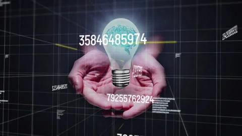 Hands holding glowing digital globe inside lightbulb amid data grid lines Stock Footage 309342726