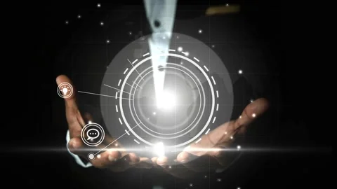 Hands holding a glowing digital interface with futuristic icons animation Stock Footage 327857811