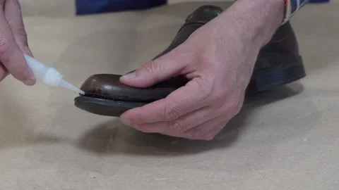 Hands holding glued sole Video stock 321482071