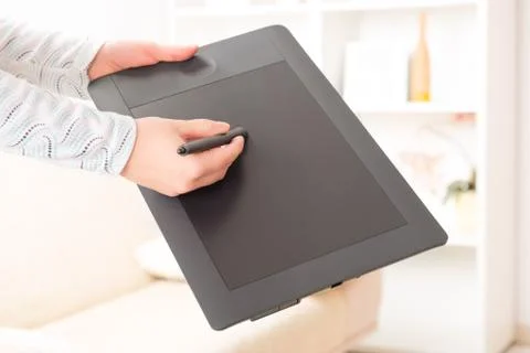 Hands holding graphic tablet Stock Photos