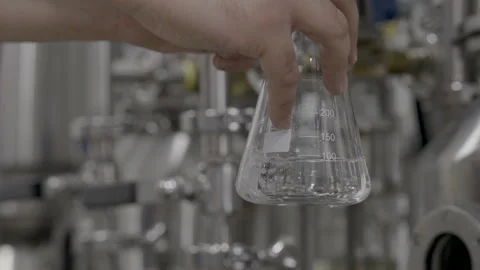 Hands Holding Herlenmeyer Flask Stock Footage 260262772