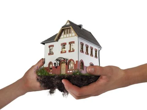 Hands holding a house. The concept of relocation, mortgage, inheritance, Stock Photos
