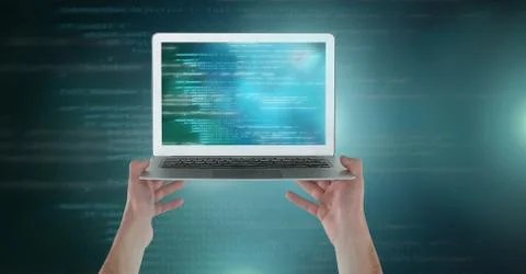 Hands holding laptop with coding text Foto stock