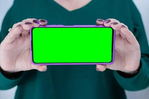 Hands holding a large smartphone Stock Photos