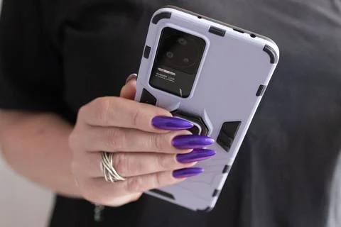 Hands holding a large smartphone Stock Photos