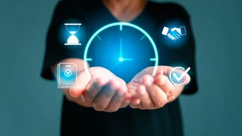 Hands holding luminous clock with task and approval icons, illustrating tim.. Stock Photos