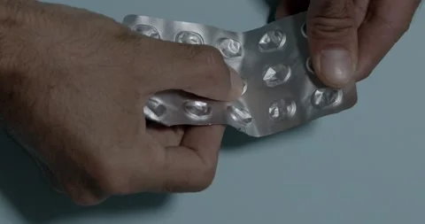 Hands holding a medication holder Stock Footage 196997542