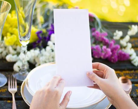 Hands holding a menu mockup Stock Photos
