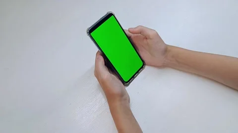 Hands holding mobile phone chroma key green screen Stock Footage 200850816