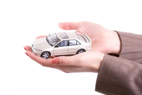 Hands holding the model of car Stock Photos