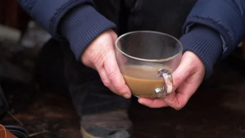 Hands holding a mug of tea Stock Footage 151691474