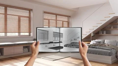 Hands holding notepad with bedroom design blueprint sketch or drawing. Real.. Stock Photos