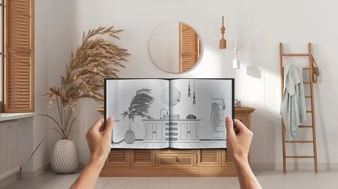 Hands holding notepad with creative bathroom design blueprint sketch or drawi Illustrazione stock