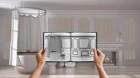 Hands holding notepad with creative bathroom design blueprint sketch or drawi Stock Photos