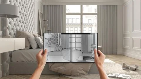 Hands holding notepad with creative bedroom design blueprint sketch or drawin Illustrazione stock