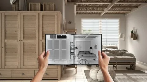 Hands holding notepad with creative bedroom design blueprint sketch or drawin Stock Photos