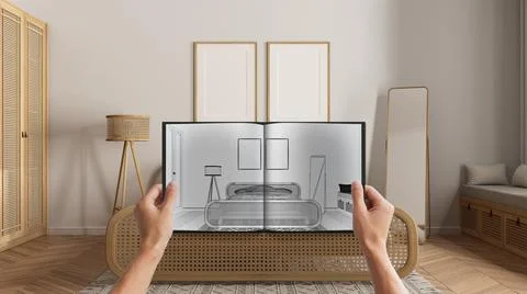 Hands holding notepad with creative bedroom design blueprint sketch or drawin Stock Photos