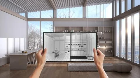 Hands holding notepad with creative kitchen design blueprint sketch or drawin Stock Photos