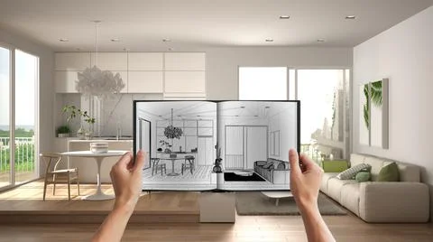 Hands holding notepad with creative kitchen design blueprint sketch or drawin Stock Photos