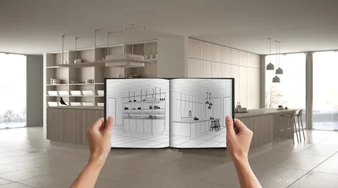 Hands holding notepad with creative kitchen design blueprint sketch or drawin Stock Photos
