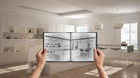 Hands holding notepad with creative kitchen design blueprint sketch or drawin Stock Photos
