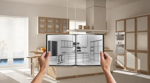 Hands holding notepad with creative kitchen design blueprint sketch or drawin Stock Photos