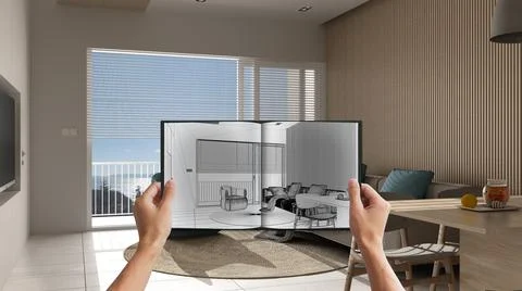 Hands holding notepad with creative living room design blueprint sketch, draw Stock Photos