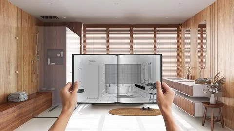 Hands holding notepad with japandi bathroom design blueprint sketch or draw.. Illustrazione stock