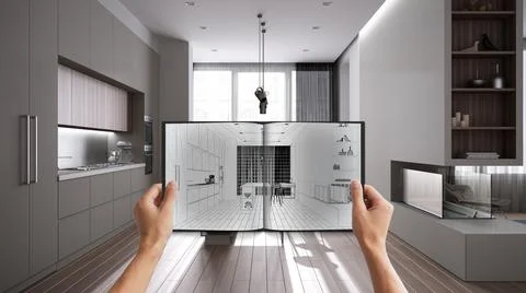 Hands holding notepad with minimal kitchen design blueprint sketch or drawing Stock Photos