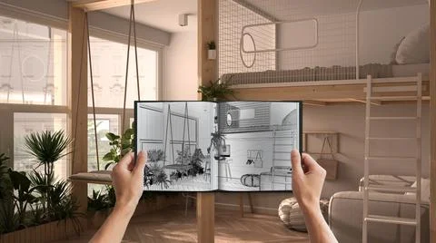 Hands holding notepad with modern studio apartment blueprint sketch or drawin Stock Photos