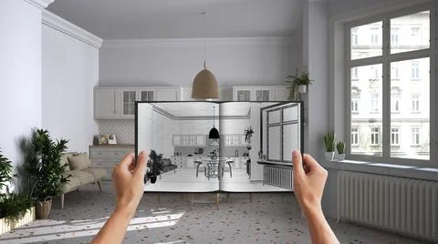 Hands holding notepad with retro white kitchen design blueprint sketch or dra Stock Photos