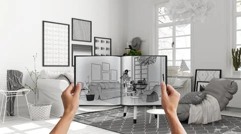 Hands holding notepad with studio apartment design blueprint sketch or drawin Stock Photos