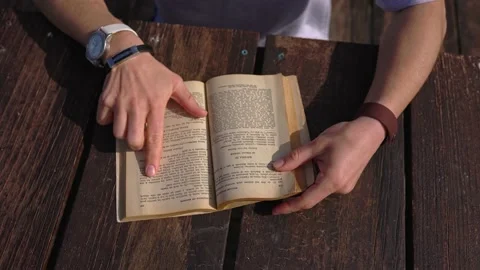 Hands holding an old book to read. Stock Footage 194742993