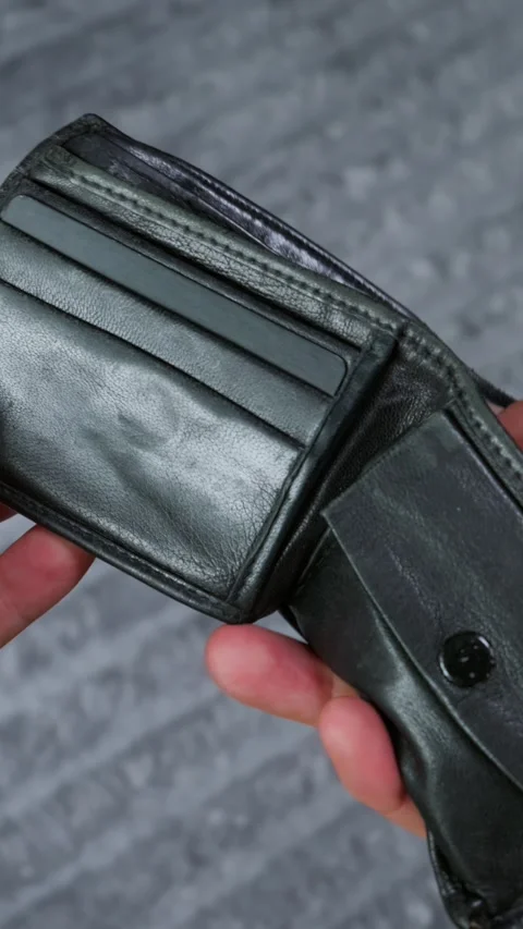 Hands Holding Open an Empty Black Leather Wallet Showing No Money Stock Footage 339205452