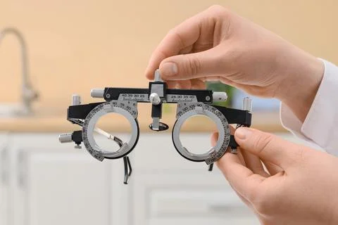 Hands holding an optometry trial frame for eye examination Stock Photos