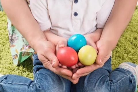 Hands holding painted easter egg Stock Photos