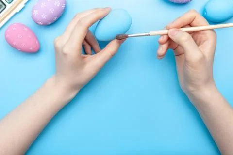Hands holding a painted egg Stock Photos