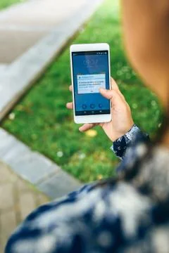 Hands holding phone with update error text on screen Stock Photos