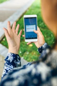 Hands holding phone with update error text on screen Stock Photos