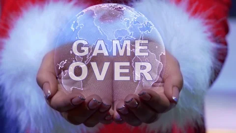 Hands holding planet with text Game Over Stock Footage 125846078