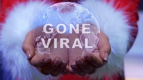 Hands holding planet with text Gone Viral Video stock 125846110