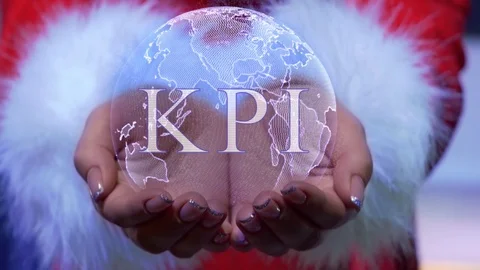 Hands holding planet with text KPI Stock Footage 124902764