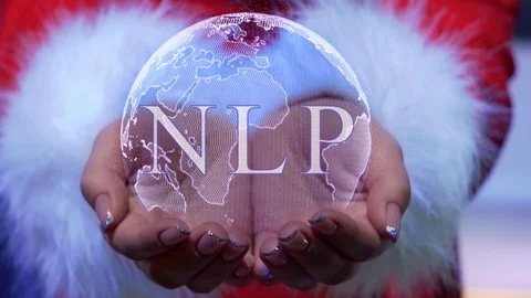 Hands holding planet with text NLP Stock Footage 126675985