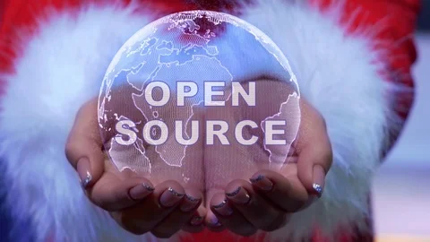Hands holding planet with text Open source Vídeos de archivo 126676238