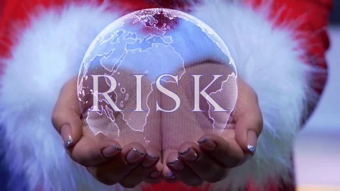 Hands holding planet with text Risk Video stock 126676700