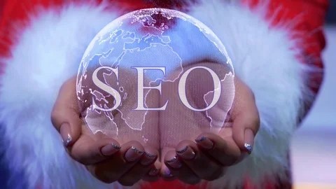 Hands holding planet with text SEO Stock Footage 126796934