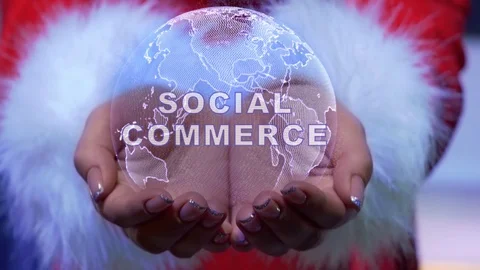 Hands holding planet with text Social commerce Stock Footage 125846413