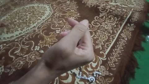 Hands holding prayer beads  Stock Footage 289445760