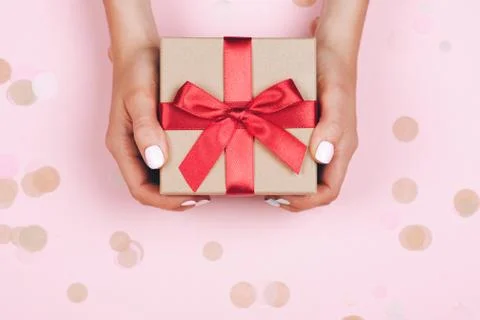 Hands holding present box Stock Photos